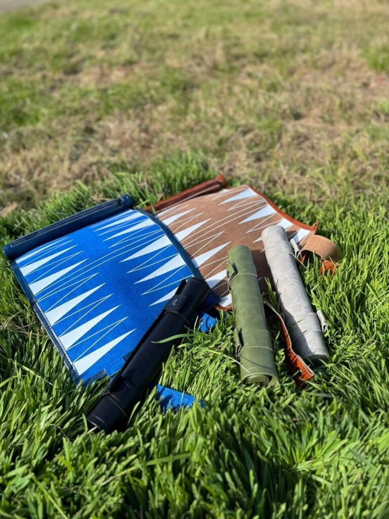 Alt text: Beginner group immersed in learning backgammon, faces showing excitement and focus.